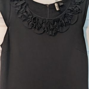 Black dress with ruffled neckline